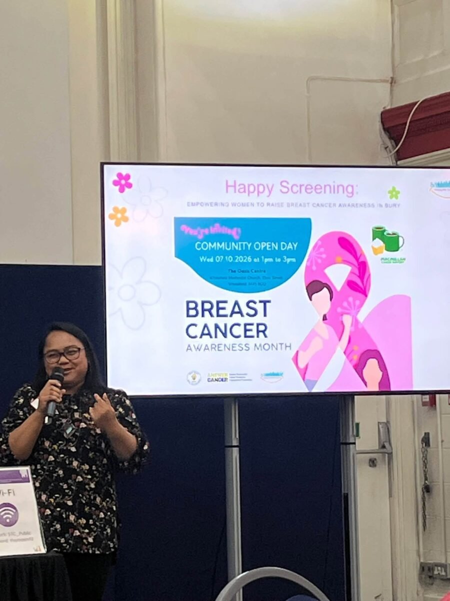 Speaker presenting Happy Screening, a breast cancer awareness project in Bury