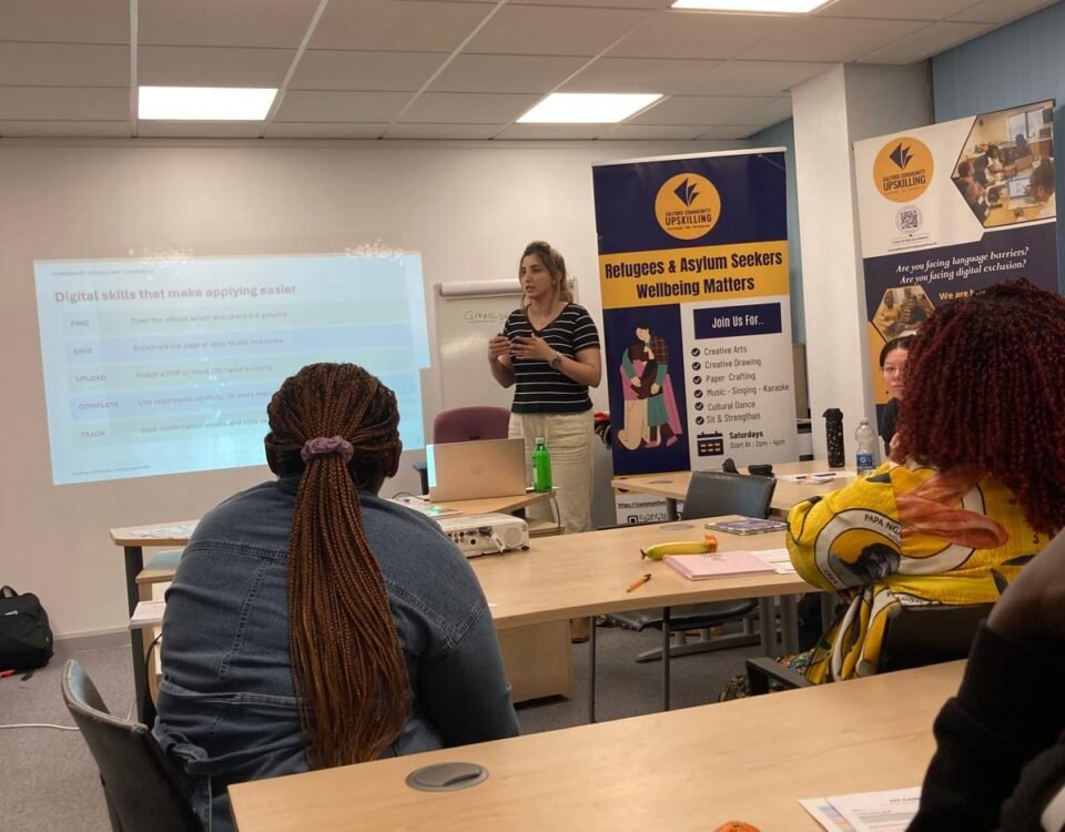 Facilitator presenting digital skills for job applications at a Community Upskilling employability session in Salford