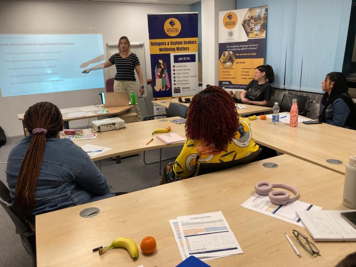 Facilitator presenting common job application mistakes to participants at a Community Upskilling session
