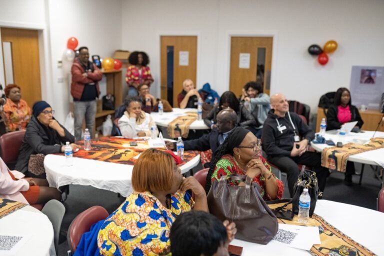 The community room filled with guests at the celebration