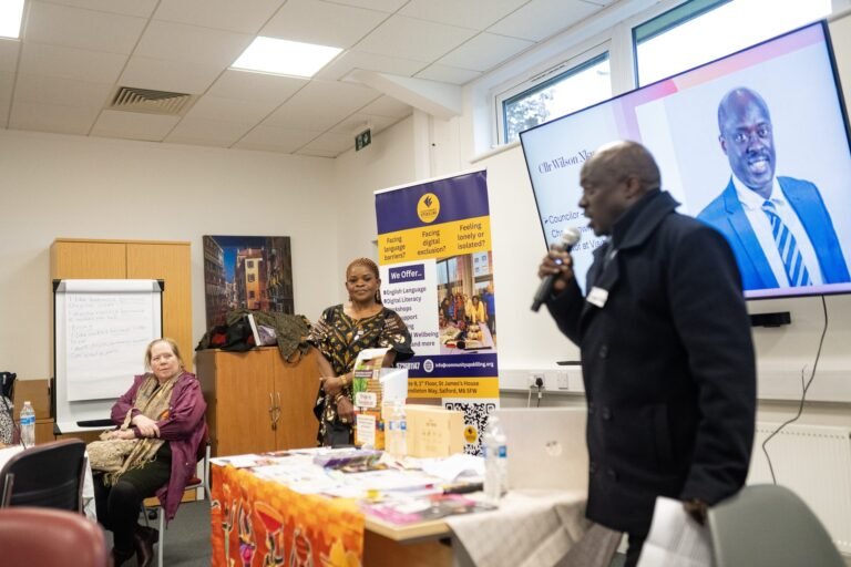 A speaker in front of the screen at the Black History Month event