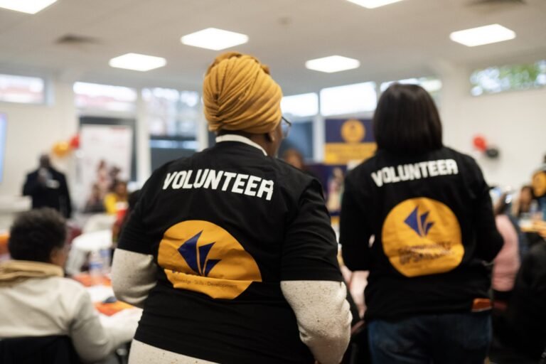 Volunteers in Community Upskilling shirts at the event