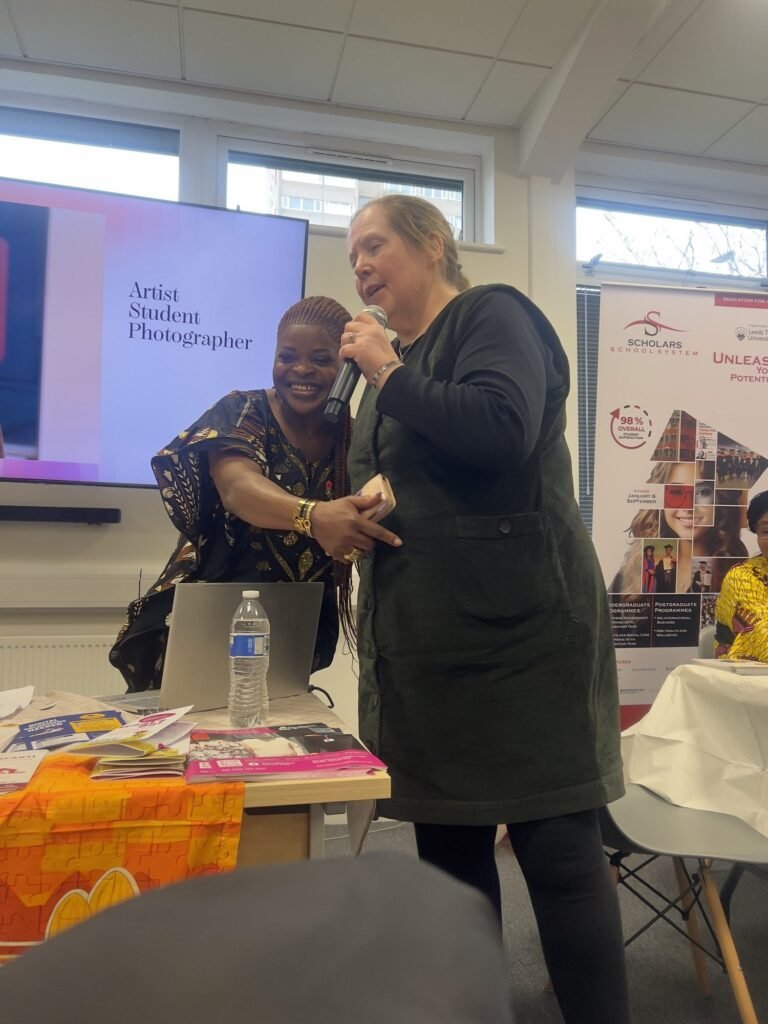 Two guests sharing a moment at the front of the room